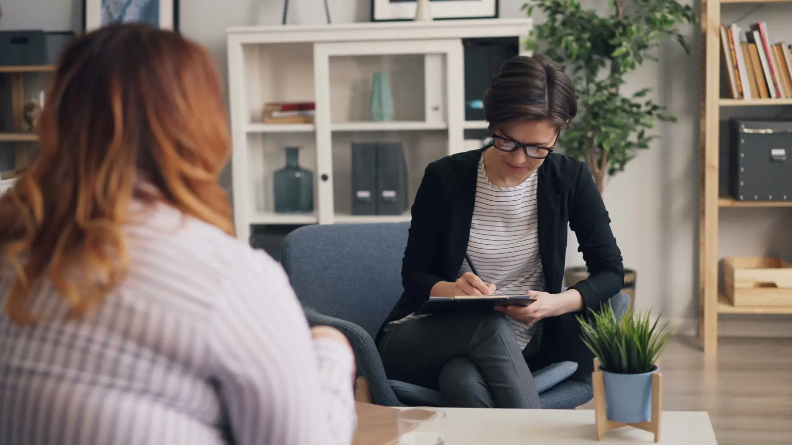 Provider sitting with a client during a session